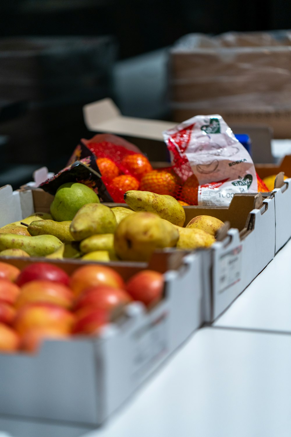 Boxes of fresh fruit and groceries ready to distribute