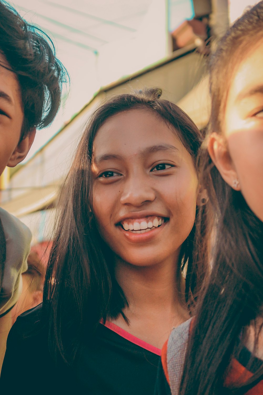 Young people smiling together in a supportive setting